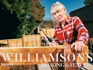 lady assembling wooden decking